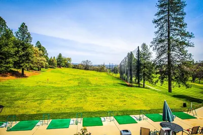 a large grassy field with a bunch of golf greens at Restoration House in Groveland