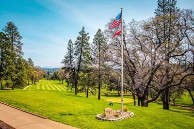 an american flag on a pole in a park at Restoration House in Groveland
