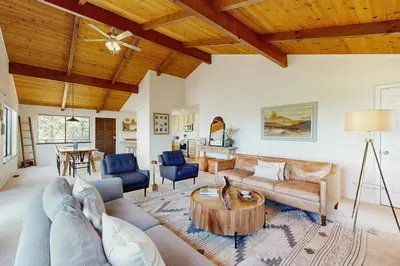 a living room with a couch and a table at Restoration House in Groveland