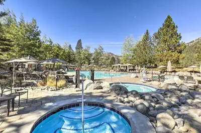 a swimming pool with a water fountain in a yard at Spa and Ski-InandOut Access! Everline Resort Studio in Olympic Valley