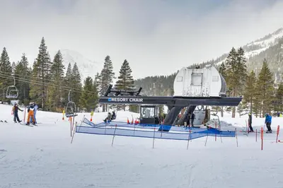 a ski lift with a house on it in the snow at Spa and Ski-InandOut Access! Everline Resort Studio in Olympic Valley