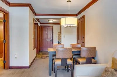 a dining room with a table and chairs at Ski-InandSki-Out and Mtn Views! Everline Resort Condo in Olympic Valley