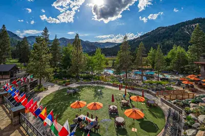 an aerial view of a resort with umbrellas at Ski-InandSki-Out and Mtn Views! Everline Resort Condo in Olympic Valley