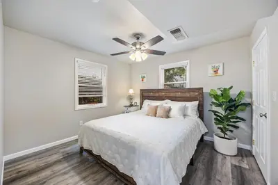 a bedroom with a bed and a ceiling fan at Midtown Apartment with Private Parking and King Bed in Sacramento