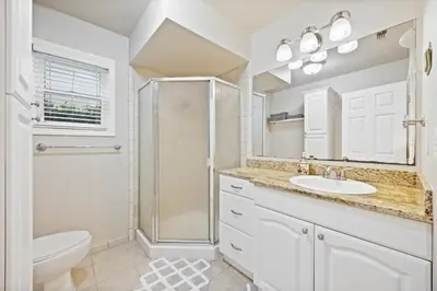 a bathroom with a shower and a sink and a toilet at Midtown Apartment with Private Parking and King Bed in Sacramento