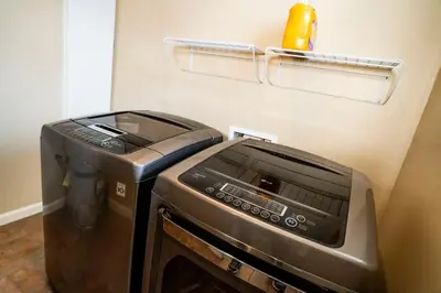 a kitchen with a toaster oven and a trash can at Eat-Sleep-Stroll-Repeat! Walkable Midtown 2BR Home in Reno