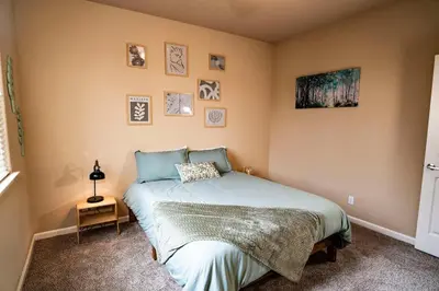 a bedroom with a bed in a room at Eat-Sleep-Stroll-Repeat! Walkable Midtown 2BR Home in Reno