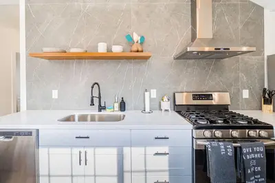 a kitchen with a sink and a stove at Stylish 2-Bedroom walking distance to Downtown in Reno