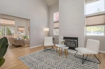 a living room with two chairs and a fireplace at Designer Home conveniently located in Reno NV in Reno