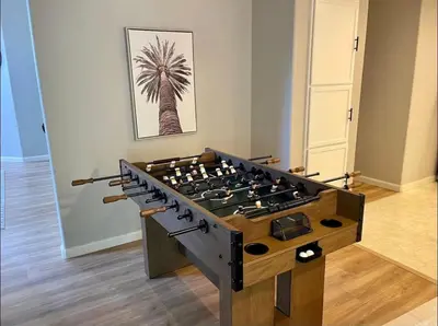 a stove in a room with a palm tree at Designer Home conveniently located in Reno NV in Reno
