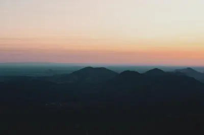 a view of a mountain range at sunset at Secluded rustic 2-bedroom cabin on private land in Miramonte