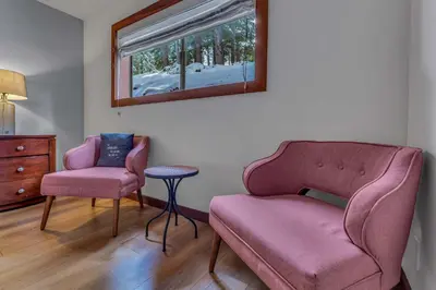 a living room with a couch and a chair and a table at Chinquapin Condo Retreat - Walk to the Lake in Tahoe City