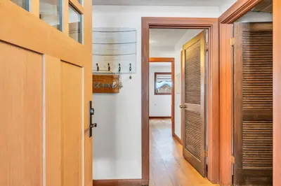 a hallway with a door leading into a room at Chinquapin Condo Retreat - Walk to the Lake in Tahoe City