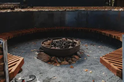 a fire pit with a pot on top of it at Mongolian yurt at a nature retreat in Miramonte