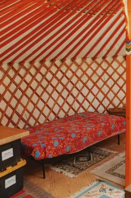 a bed in a room with a yurt at Cosy yurt at a nature retreat in CA in Miramonte