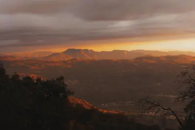 a view of a mountain range at sunset at Cosy yurt at a nature retreat in Sequoia Forest in Miramonte