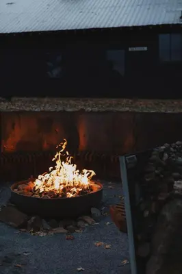 a fire in a pot on the ground at Cosy yurt at a nature retreat in Sequoia Forest in Miramonte