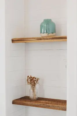 a shelf in a bathroom with a vase on it at Spacious 4-bedroom cabin on secluded private land in Miramonte