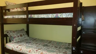 a bedroom with two bunk beds with a pillow at Moderne Hostel in Mammoth Lakes