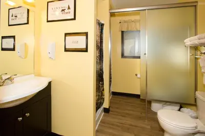 a bathroom with a toilet and a sink at Moderne Hostel in Mammoth Lakes