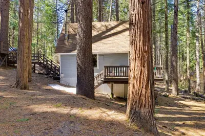 a small house in the woods with trees at Hike, Ski and Sip Arnold Cabin 4 Mi to State Park! in Arnold
