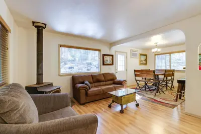 a living room with a couch and a table at Stay Near Big Trees, Bring Your Pets Arnold Cabin in Arnold