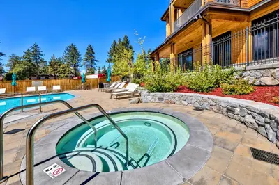 a hot tub in a patio next to a house at Pinnacle Stateline Resort BBQ Hot Tub Pool Zalanta 214 in Stateline