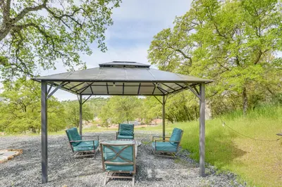 a group of chairs under a gazebo at Coulterville Home with Gazebo Near Lakes and Hiking! in Coulterville