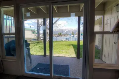 an open glass door with a view of a yard at TKC0604 - Betty Ann's Place condo in South Lake Tahoe