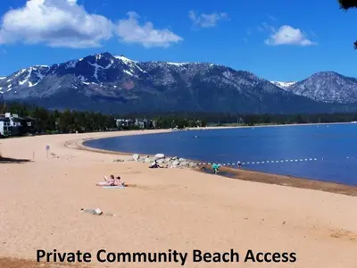 a beach with people on it with mountains in the background at TKC0604 - Betty Ann's Place condo in South Lake Tahoe