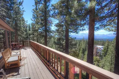 a deck with a table and chairs on top of trees at HCH1221 - Tahoe Bonoff Venture home in South Lake Tahoe