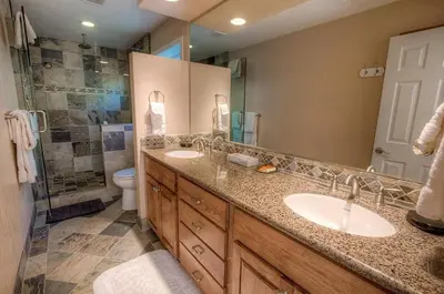 a bathroom with two sinks and a shower at HCH1221 - Tahoe Bonoff Venture home in South Lake Tahoe