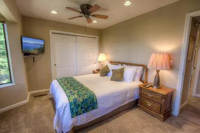 a bedroom with a bed and a ceiling fan at HCH1221 - Tahoe Bonoff Venture home in South Lake Tahoe
