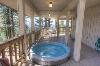 a hot tub on the porch of a house at HCH1221 - Tahoe Bonoff Venture home in South Lake Tahoe