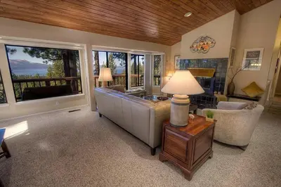 a living room with a couch and a table with a lamp at HCH1221 - Tahoe Bonoff Venture home in South Lake Tahoe