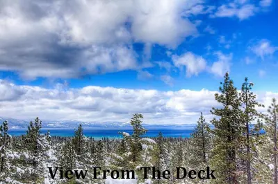 a view from the deck with trees and the sky at HCH1475 - Heavenly Lake View Retreat home in South Lake Tahoe