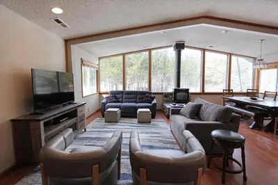 a large living room with a couch and a television at COH1261 - Nature's Gem home in South Lake Tahoe