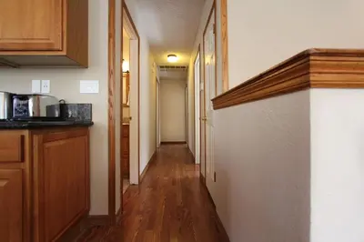 a hallway of a home with a kitchen and a hallway at COH1261 - Nature's Gem home in South Lake Tahoe