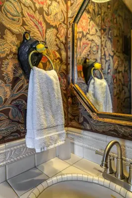 a bathroom with a sink and a mirror and towels at HCH1239 - Heavenly Tree House home in South Lake Tahoe