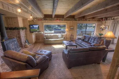 a living room with leather furniture and a fireplace at TKH1226 - Emerald Lodge home in South Lake Tahoe