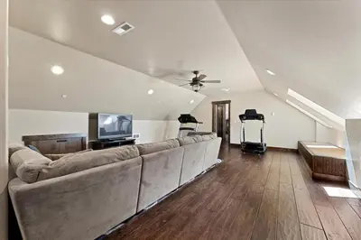 a living room with a large couch and a tv at CYH1012 - Hidden Cedar home in South Lake Tahoe