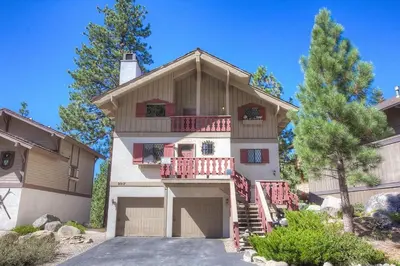 a large house with a balcony and a driveway at HCH1217 - Pinehill Ponderosa home in South Lake Tahoe
