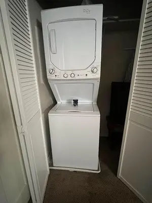 a small white refrigerator with a washer and dryer at HCC0410 - Heavenly Hideaway condo in South Lake Tahoe