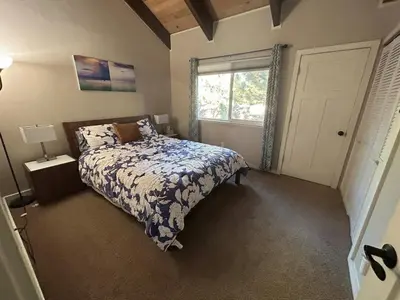 a bedroom with a bed and a window at HCC0410 - Heavenly Hideaway condo in South Lake Tahoe
