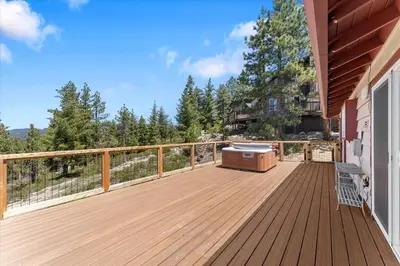 a wooden deck with a grill on the side of a house at HCH1083 - Mountain Serenity home in South Lake Tahoe