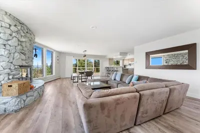 a living room with a couch and a fireplace at HCH1083 - Mountain Serenity home in South Lake Tahoe