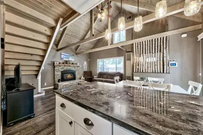 a kitchen and living room with a large counter top at CYH0876 - Island Cabin cabin in South Lake Tahoe
