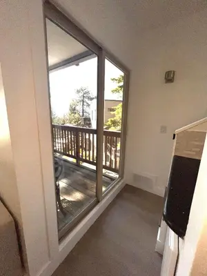 a room with a balcony with a sliding glass door at LVC0615 - Lake Therapy condo in Zephyr Cove