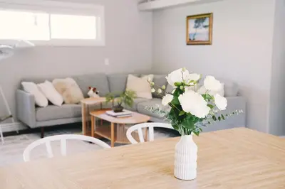 a vase of flowers on a table in a living room at A Luxury Yosemite Retreat in Mariposa