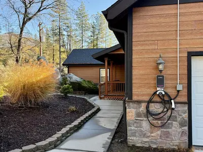 a house with a walkway leading to the front door at Elegant Blackwood Grove by Casa Oso in Mariposa